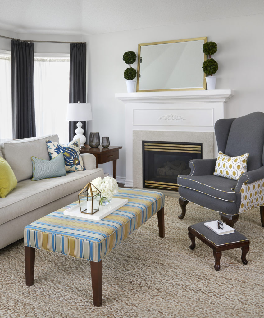 living room with neutral furniture and bright colourful accents