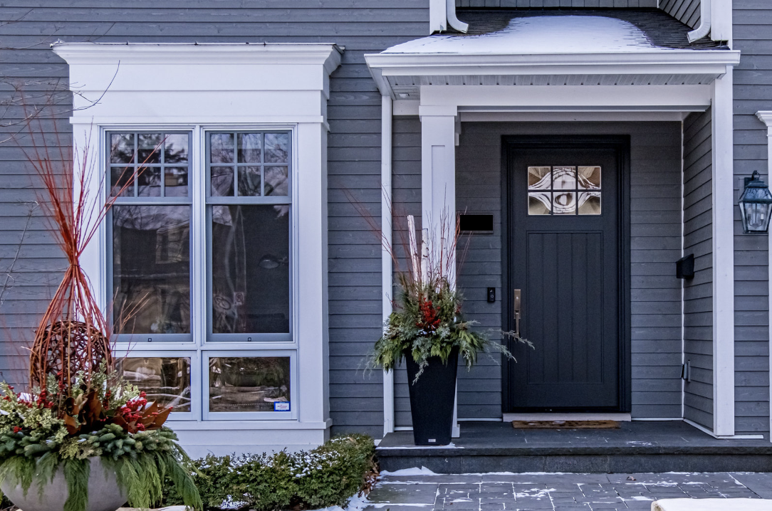 exterior of home in south east oakville showing front door with christmas planters beside