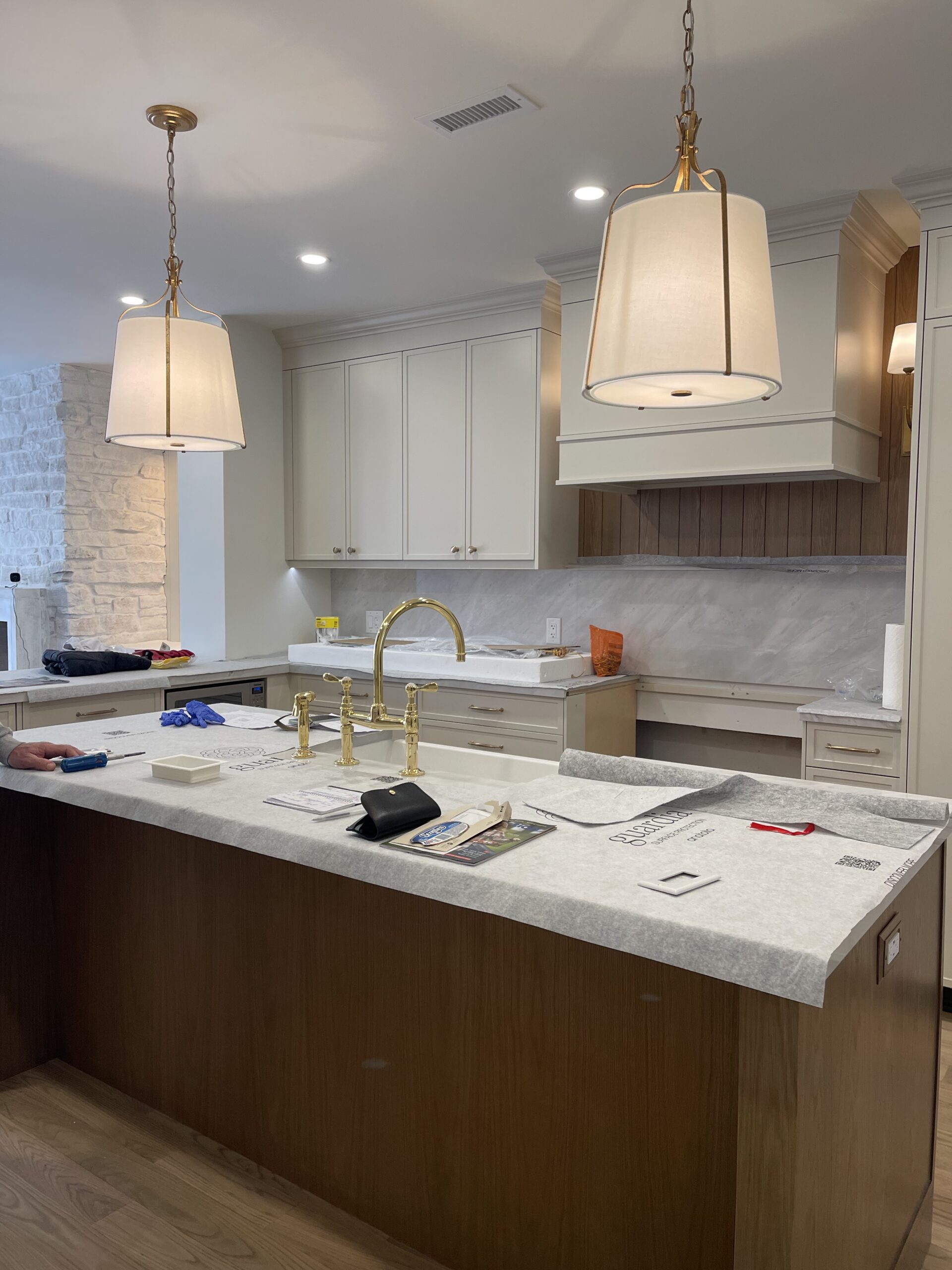 interior design project in Rosedale showing kitchen with white cabinets and wood island