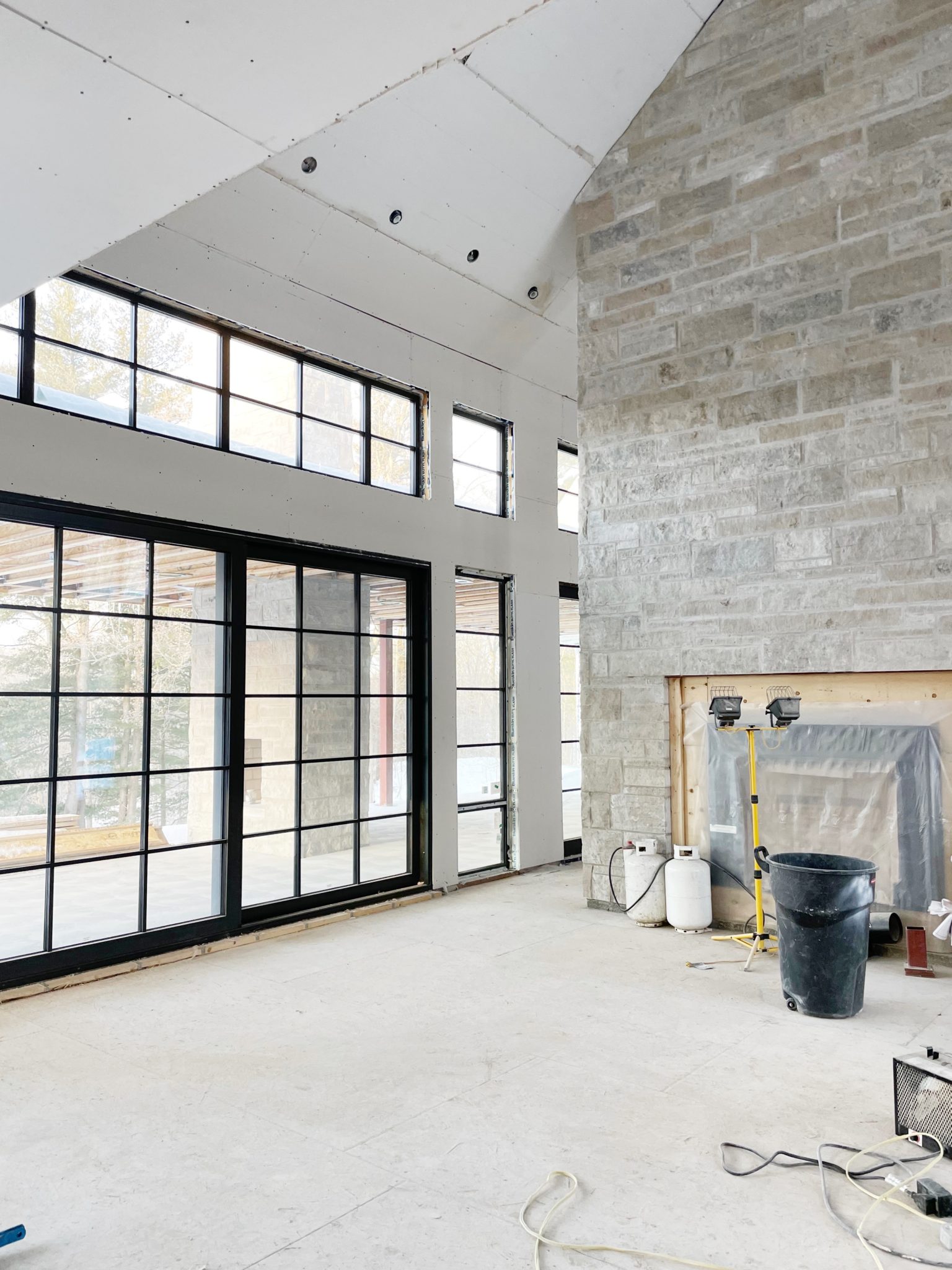 interior under renovation with stone fireplace