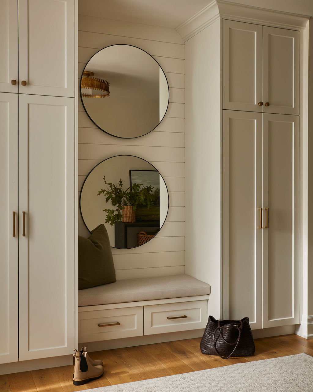 Warm, timeless foyer design with layered neutrals and custom cabinetry by Staci Edwards Design in Hamilton, Ontario
