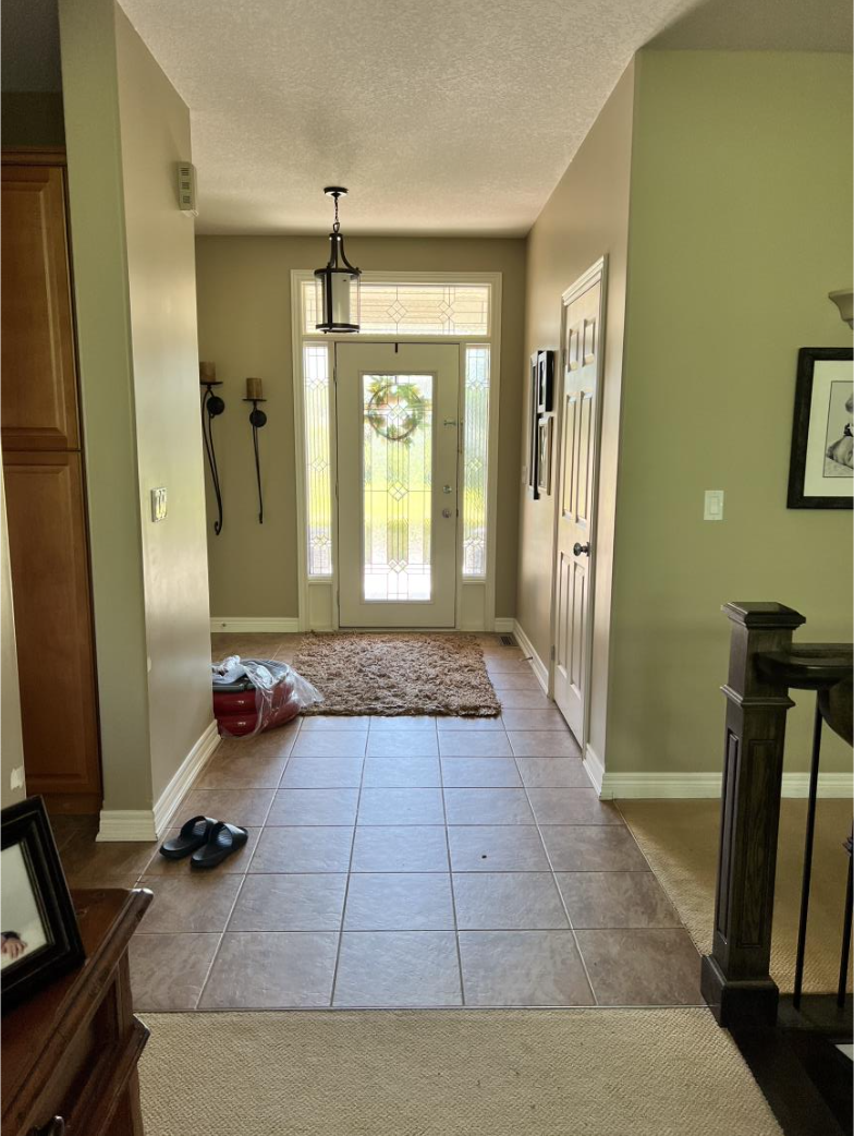 Before photo of the dated foyer in the Freelton home near Hamilton, Ontario