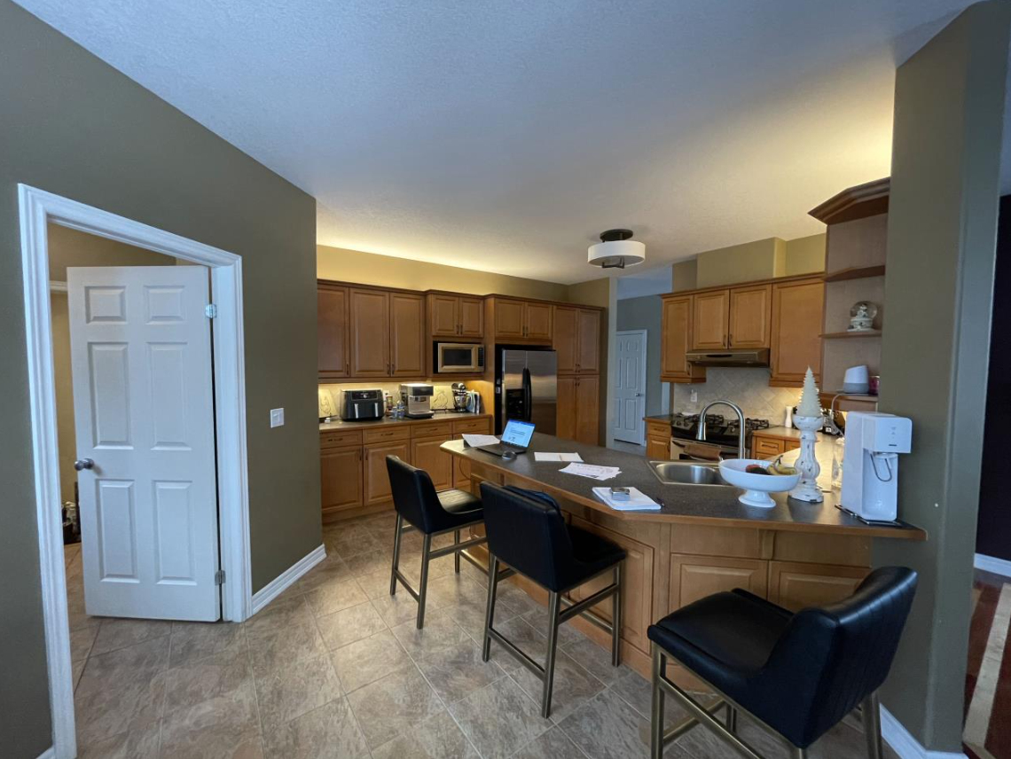 Before photo of the older kitchen layout prior to renovation