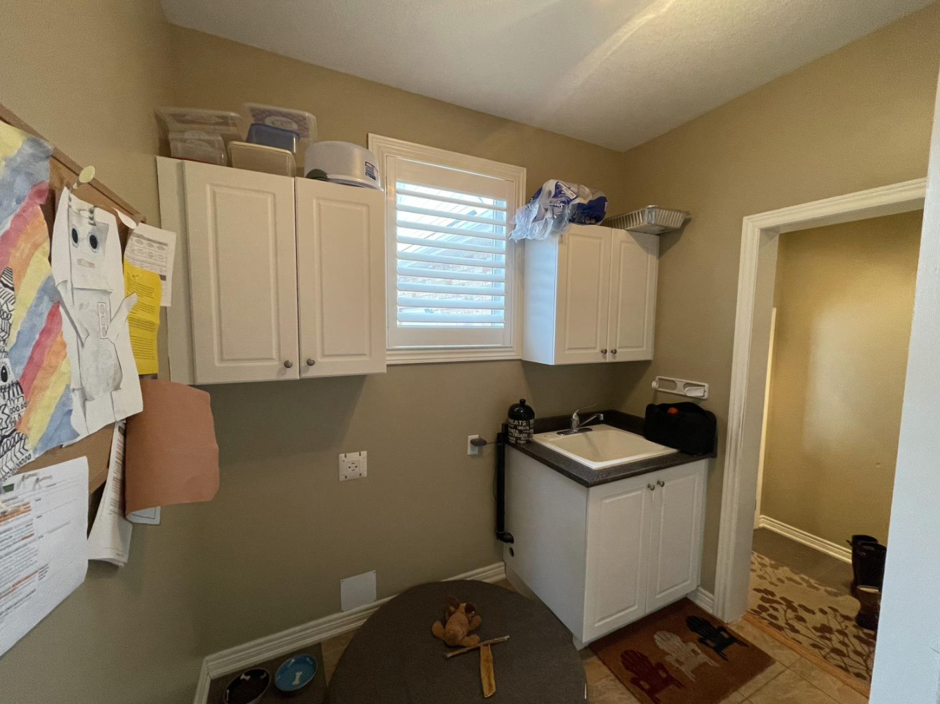 Before photo of the dated mudroom in this Hamilton-area family home