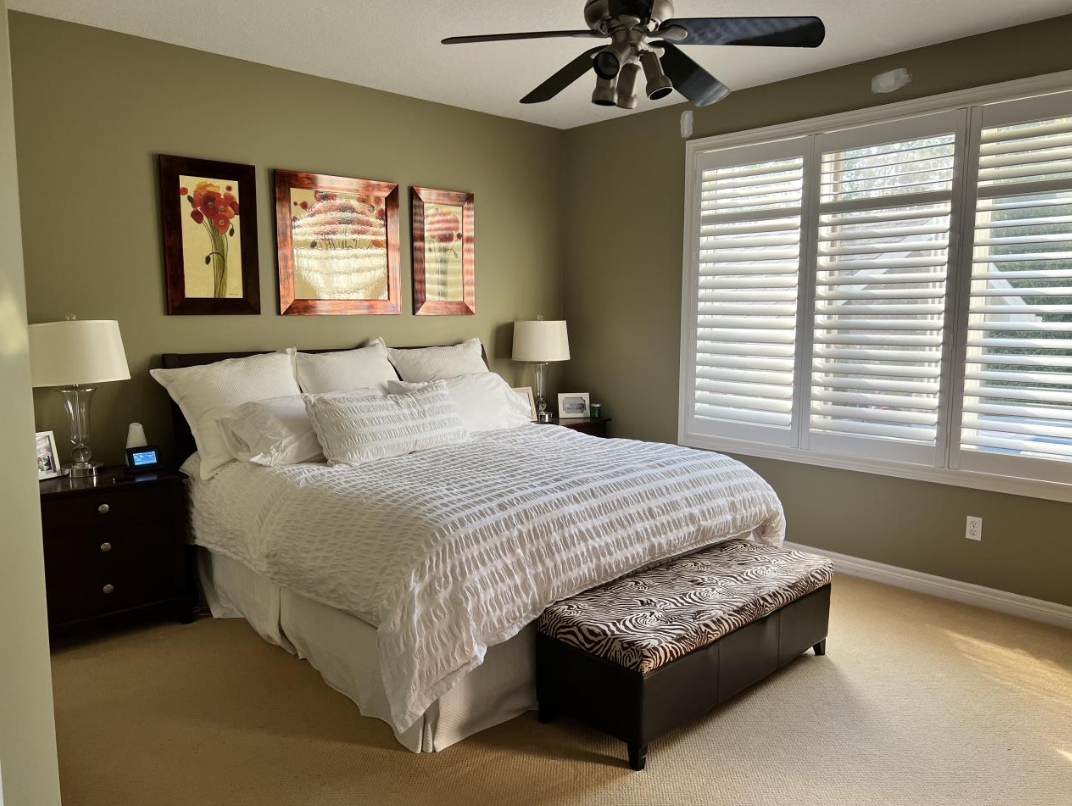 Before photo of the principal bedroom in need of refreshing